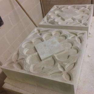 Gothic tracery panels in Portland stone.