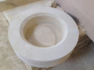 Circular window in one piece carved in Sherborne stone. 