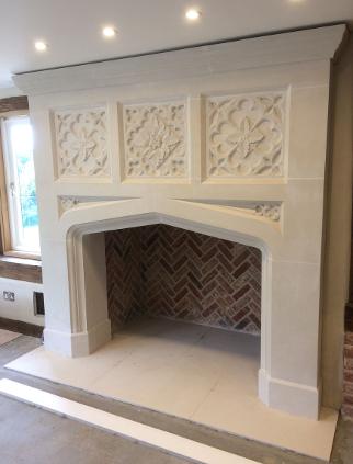 New Carved Gothic Fireplace with oak leaf tracery panels . 